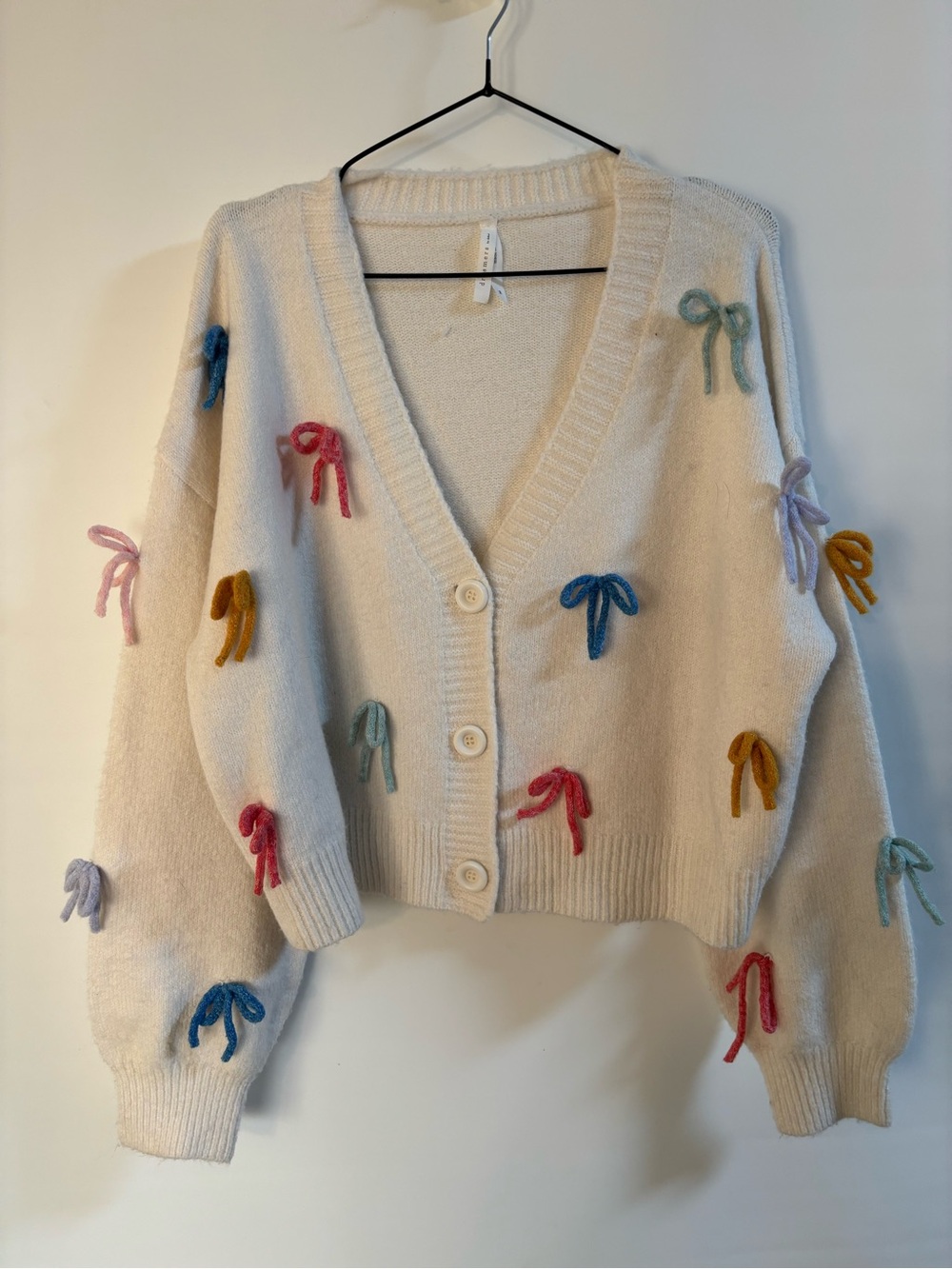 Dreamers Cream V-Neck Button Cardigan with Multicolor Bow Embellishments